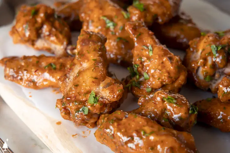 closer view of chipotle wings on a platter