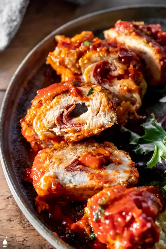 closer view of pizza stuffed chicken rolls, one of the many stuffed keto chicken recipes