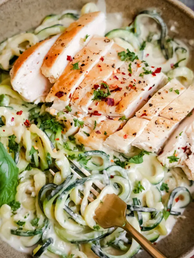 creamy chicken alfredo twirled around a fork. This keto chicken recipe is made with zucchini noodles instead of pasta