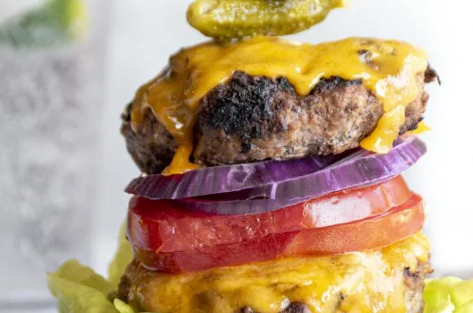 bunless burger with cheese and vegetable toppings, lettuce wrapped