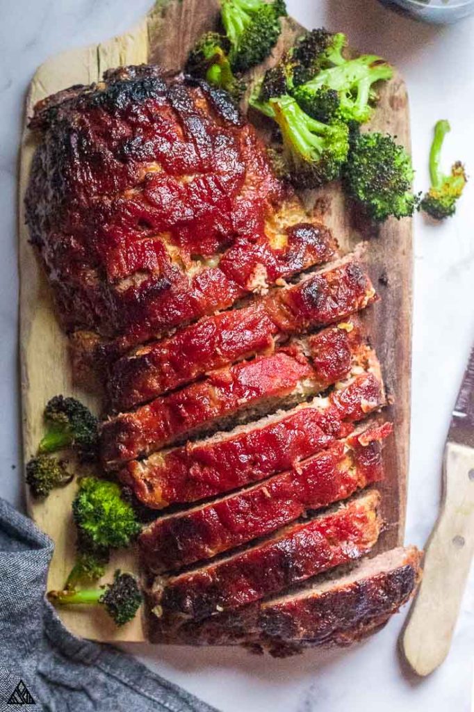 Sliced low carb meatloaf on a chopping board