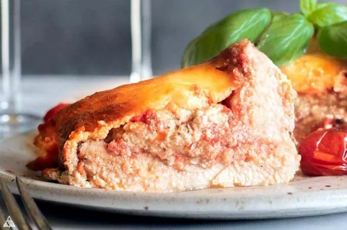 Closer look of a sliced lasagna stuffed chicken