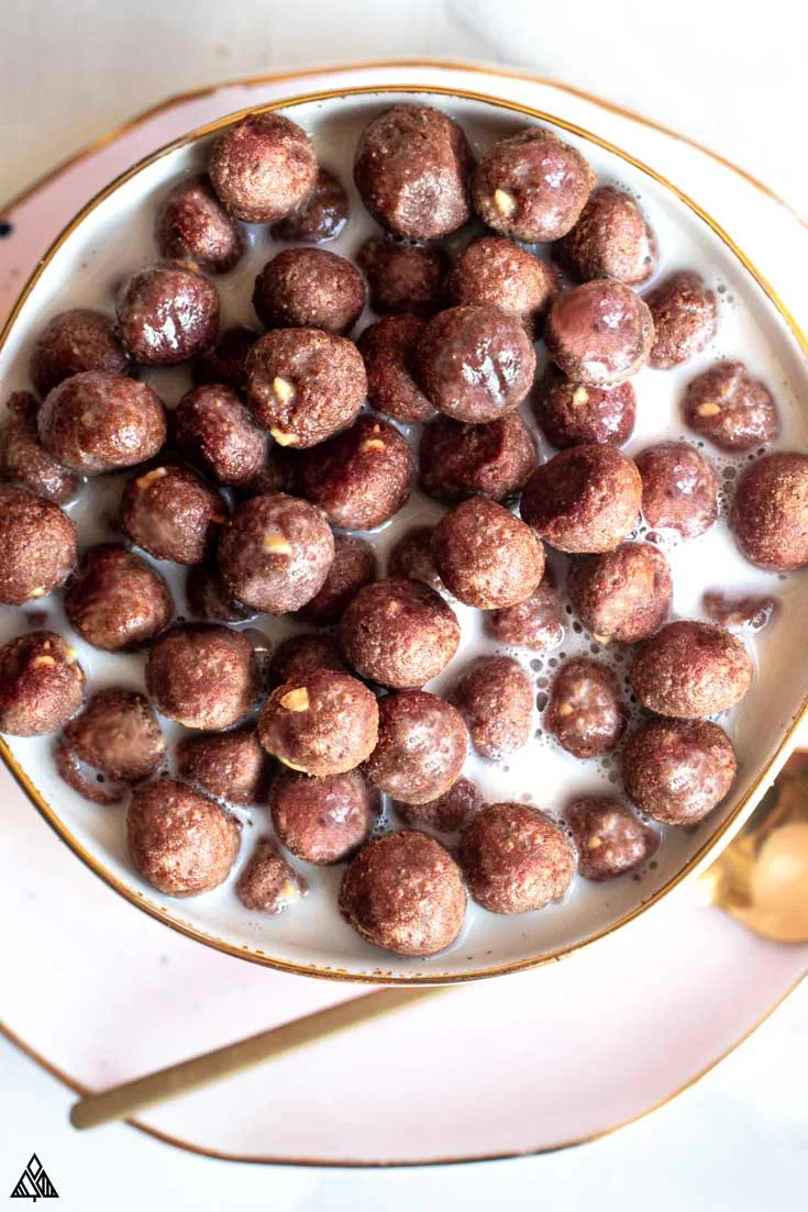 Low carb cocoa puffs in a bowl with milk