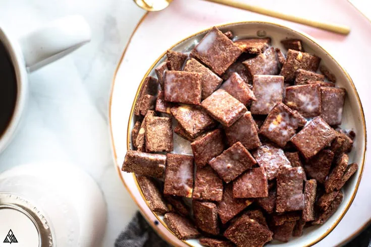 A bowl of small squares low carb cocoa puffs