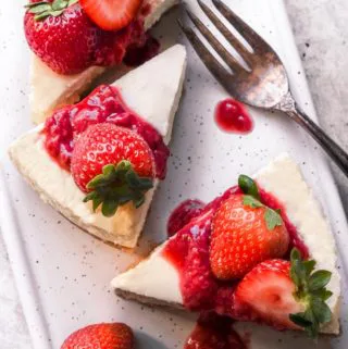 Slices of low carb cheesecake with strawberries on top