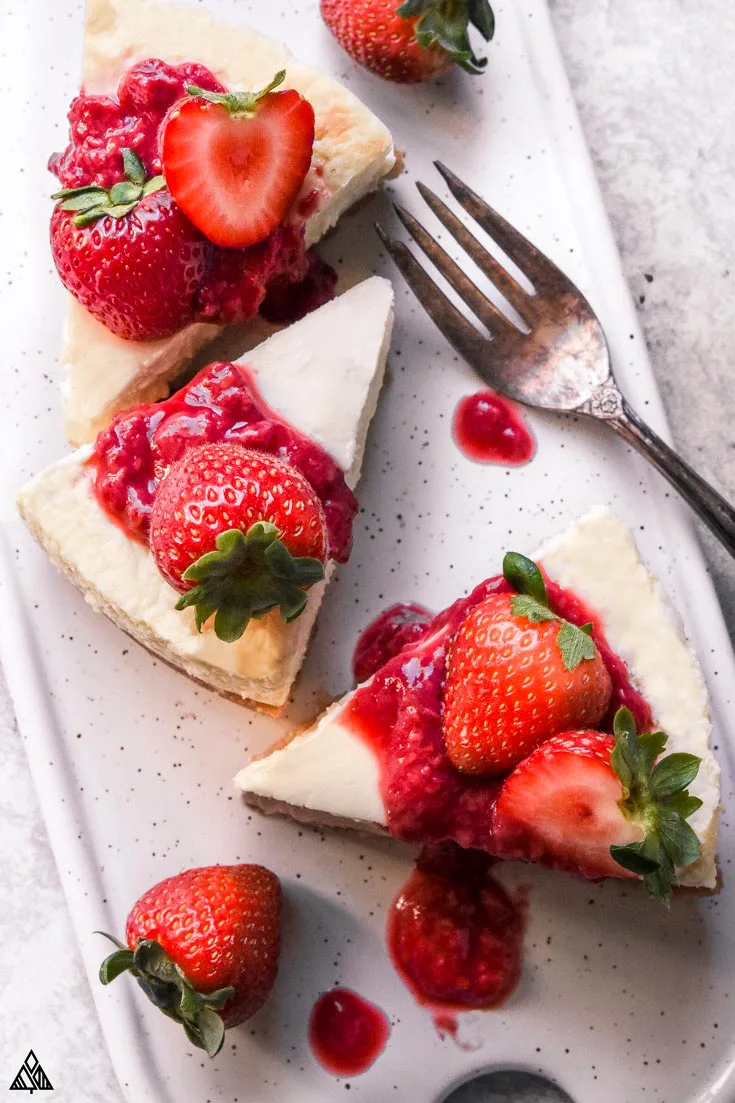 Slices of low carb cheesecake with strawberries on top