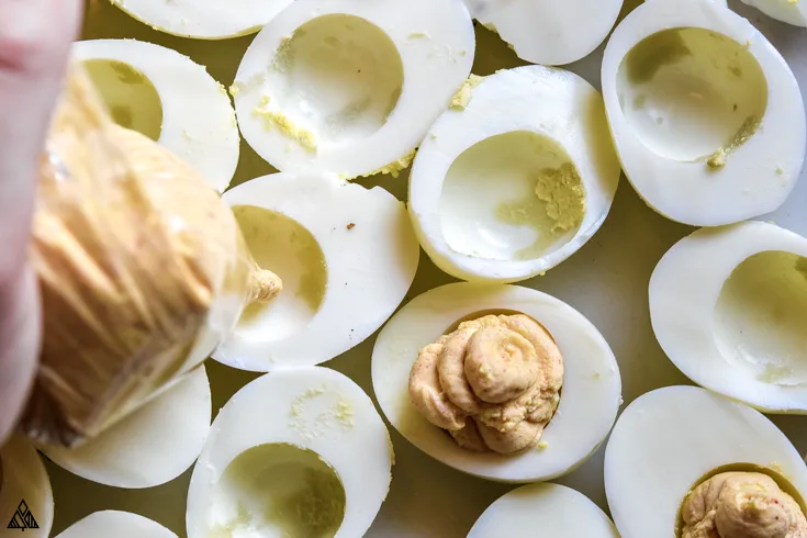 Top view of sliced hard boiled eggs without the egg yolks