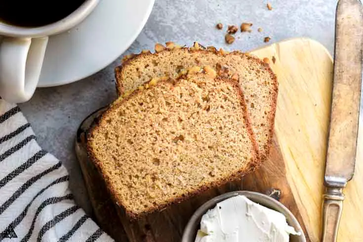 sliced keto banana bread with cream cheese frosting