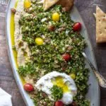 Tabouleh in a plate with egg and slices of bread