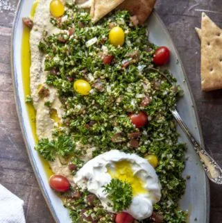 Tabouleh in a plate with egg and slices of bread