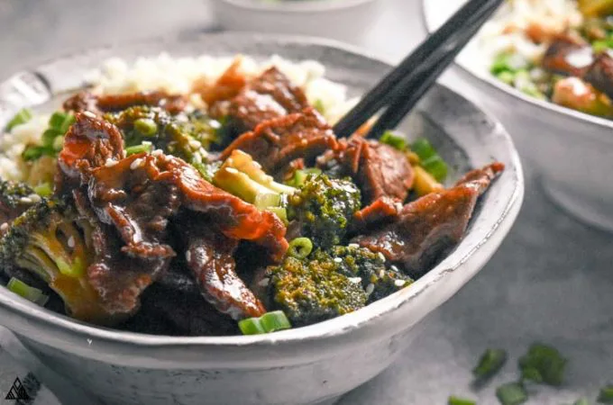 bowl of low carb beef and broccoli with chopsticks