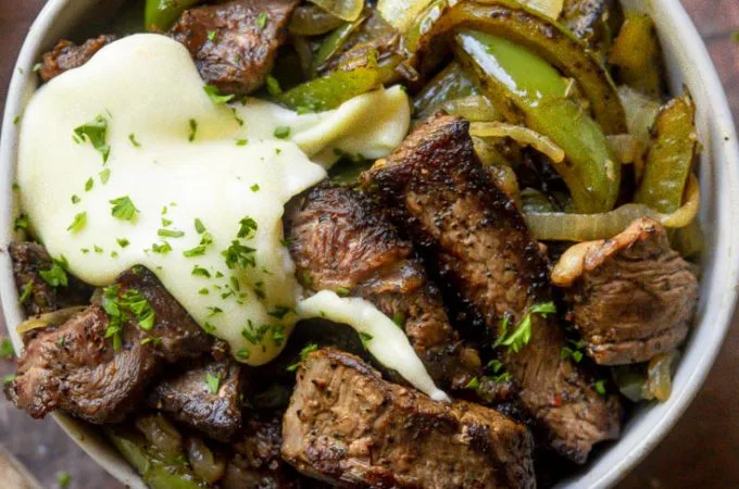 Closer look of philly cheesesteak in a bowl