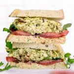 pesto chicken salad sandwich sliced stacked