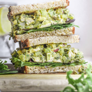 stack of avocado chicken salad sandwiches