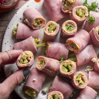 close up shot of buffalo chicken roll ups on a plate