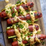 Low carb cheese dogs on a cutting board
