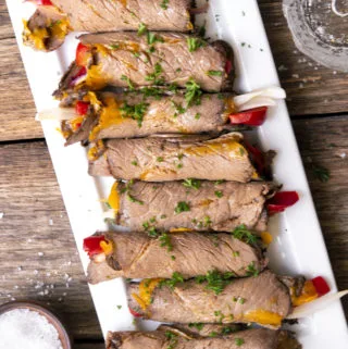 Top view of roast beef roll ups in a plate