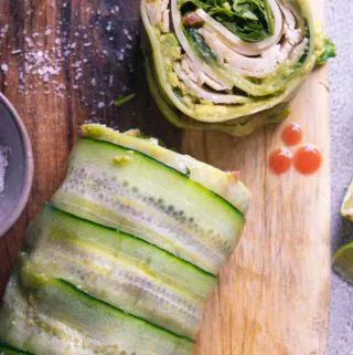sliced cucumber wraps on a wooden board