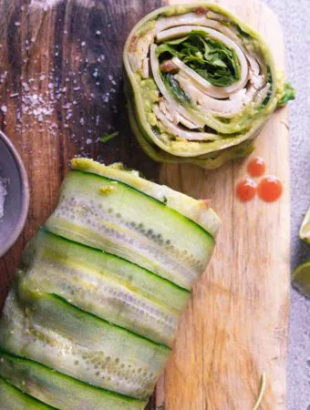 sliced cucumber wraps on a wooden board