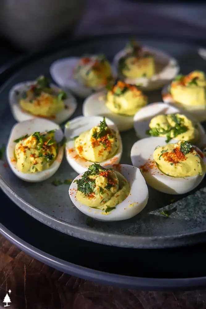 closer view of deviled avocado eggs without mayo on a plate
