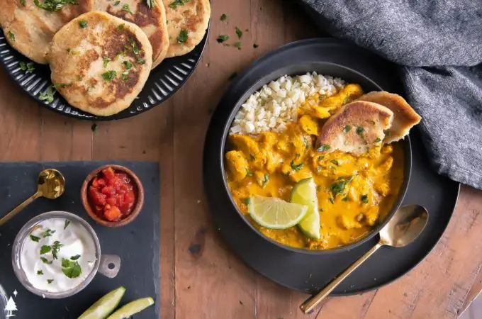 top view of keto chicken curry in a bowl with low carb naan