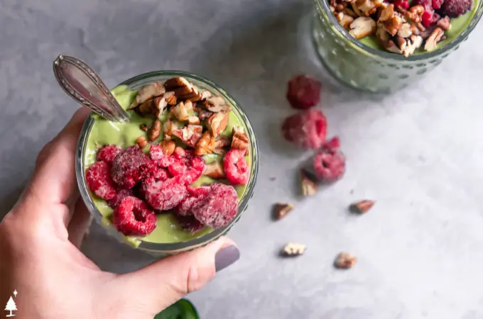 top view of keto green smoothie with berries in a glass