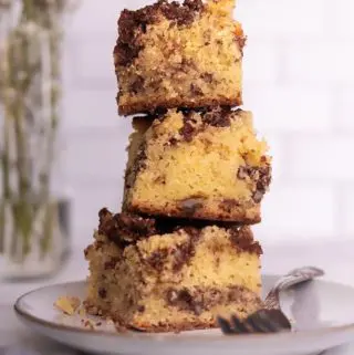 a stack of keto coffee cake slices on a plate