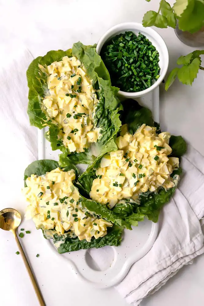 egg salad recipe without mustard on a platter with chives 