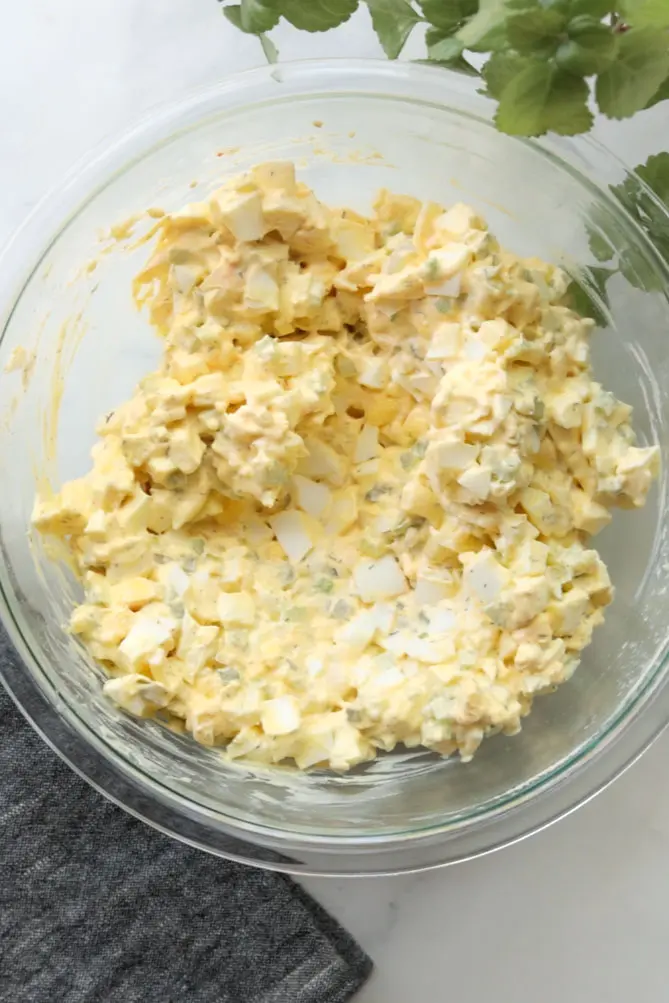 all classic egg salad recipe ingredients combined together in a bowl