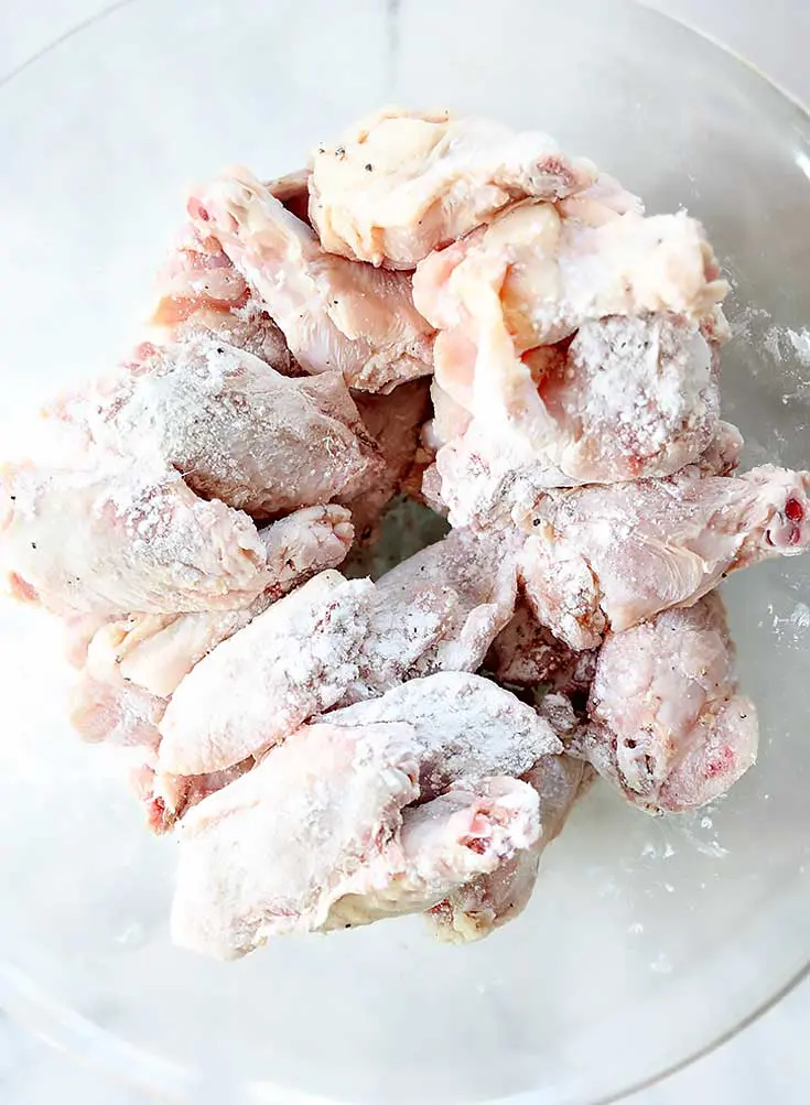 tossing chipotle wings in baking powder and salt
