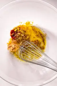 Mediterranean chicken marinade ingredients in a bowl