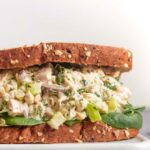 easy chicken salad sandwich with lettuce on a cutting boards