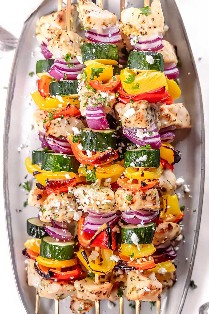 top view of mediterranean chicken kabobs in oven