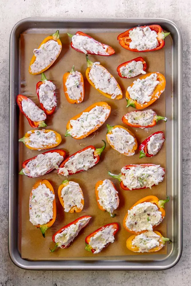 closer view of healthy stuffed mini peppers on a sheet pan