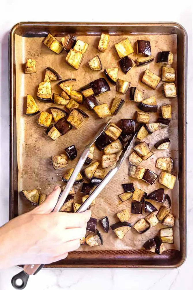 top view of roasted eggplant slices on a baking sheet