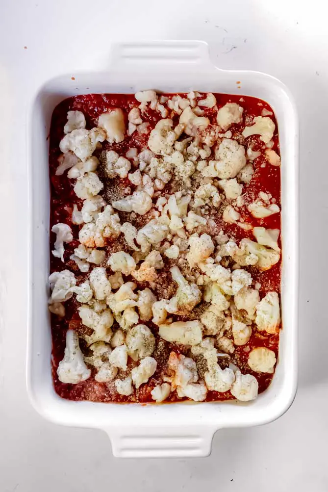 top view of cauliflower lasagna keto with seasoning