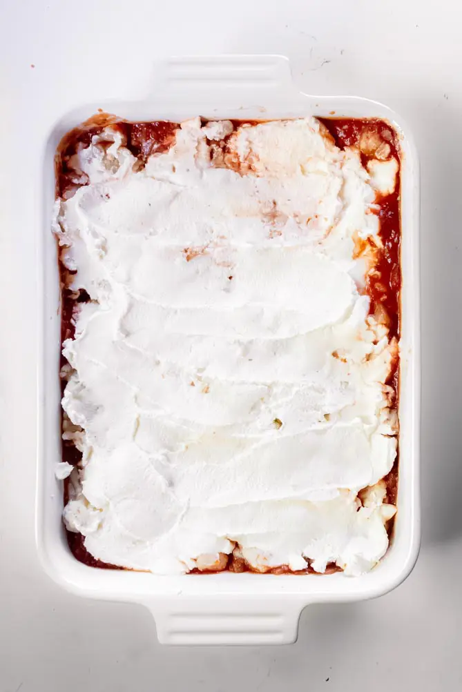 top view of cauliflower lasagna keto topped with ricotta