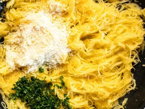 top view of spaghetti squash with parmesan and herbs