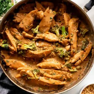 peanut butter chicken in a pan with toppings
