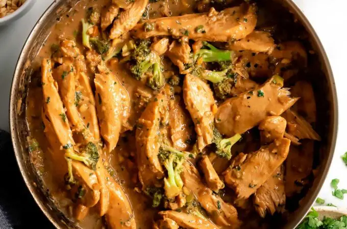 sticky peanut butter chicken in a pan