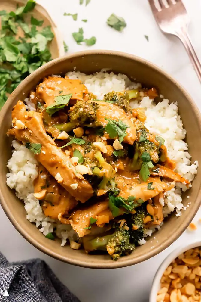 bowl of asian peanut butter chicken with cauliflower rice
