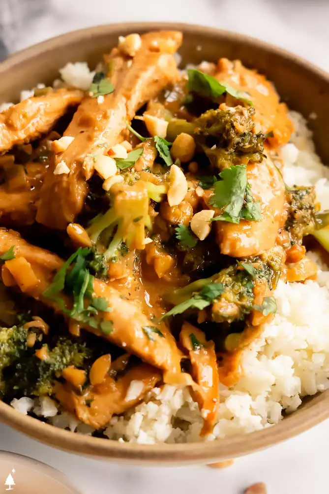bowl of chinese peanut butter chicken over rice