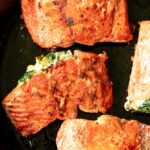 cream cheese stuffed salmon in a skillet