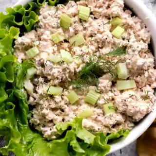 canned salmon salad in a bowl with lettuce
