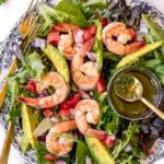 avocado shrimp salad on a plate with dressing