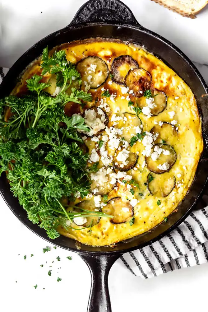 zucchini frittata recipes from above with herbs and cheese on top