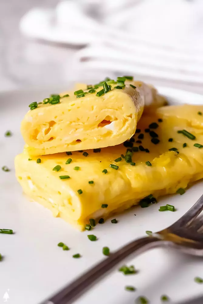 omelette recipes sliced in half to show creamy interior
