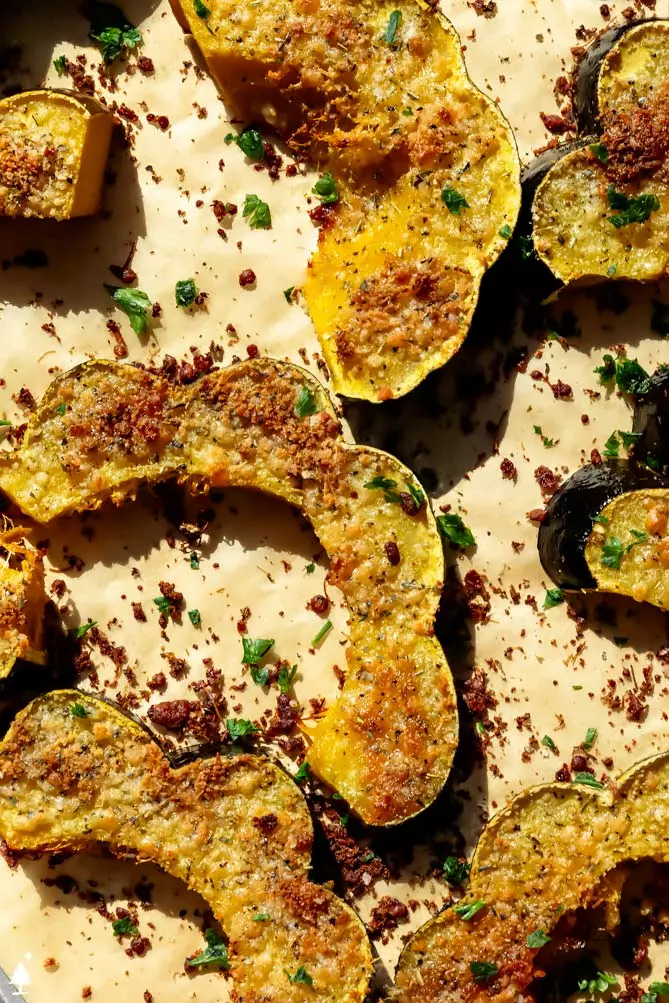 how to cook acorn squash on a rimmed baking sheet with parmesan and herbs