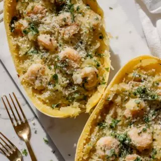 shrimp scampi spaghetti squash stuffed inside spaghetti squash boats with 2 fgorks