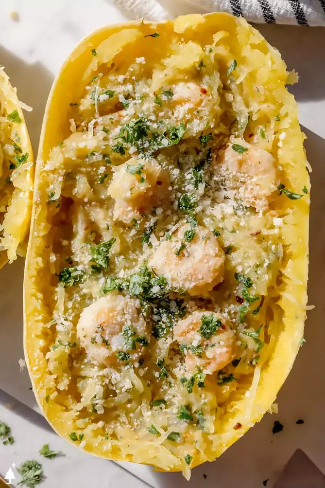 spaghetti squash with shrimp boasts with parsley on top